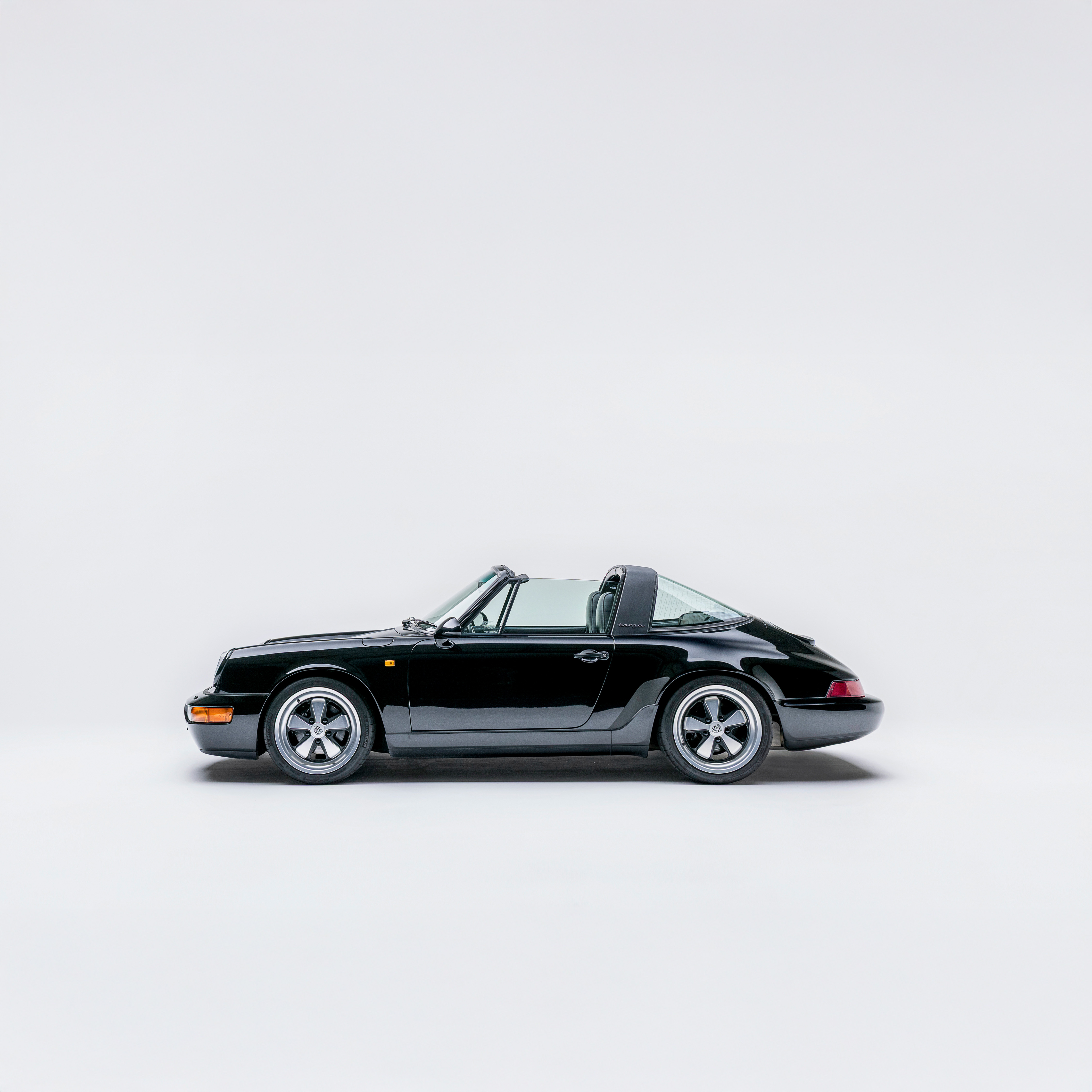 Porsche 964 Carrera 2 targa in black — side profile